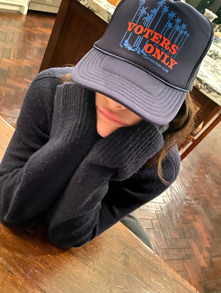 Singer / Musician Gracie Abrams in the VOTERS ONLY Foam Front Trucker Hat for the Kamala Harris / Comma LA / Voters Only Collection