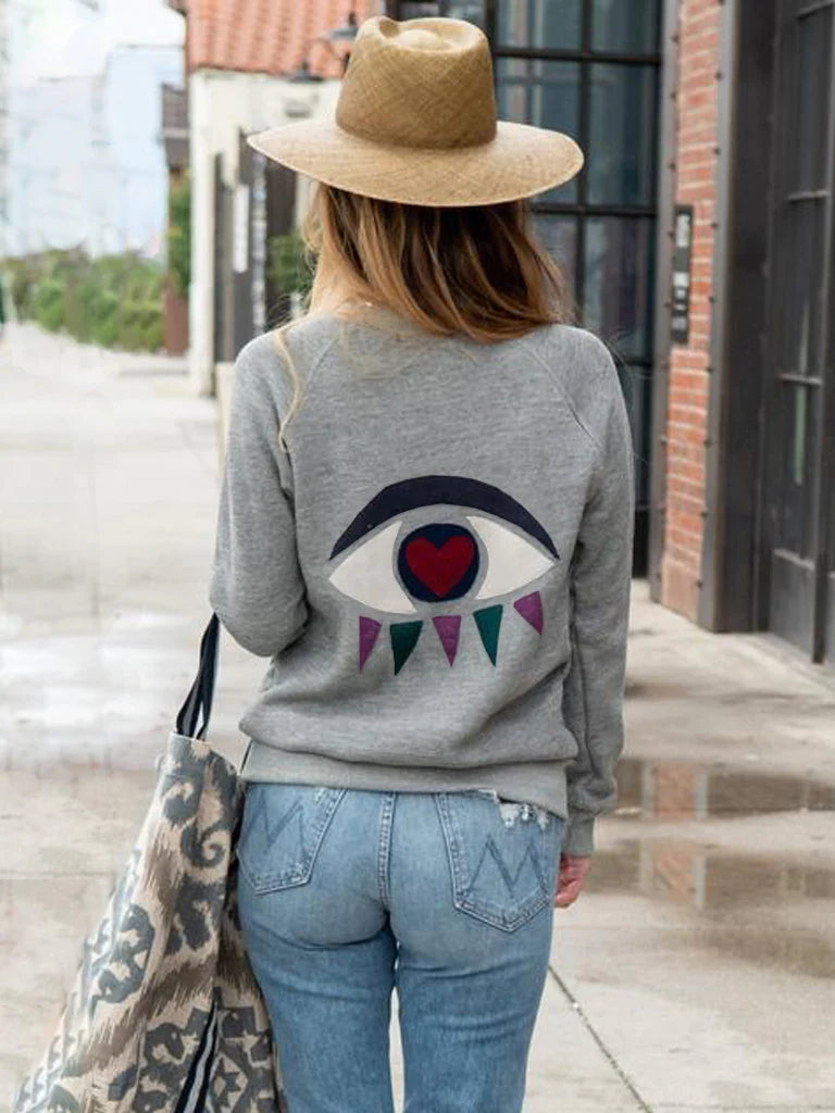 Product Spotlight: Eyes On You Cashmere Applique Sweatshirt